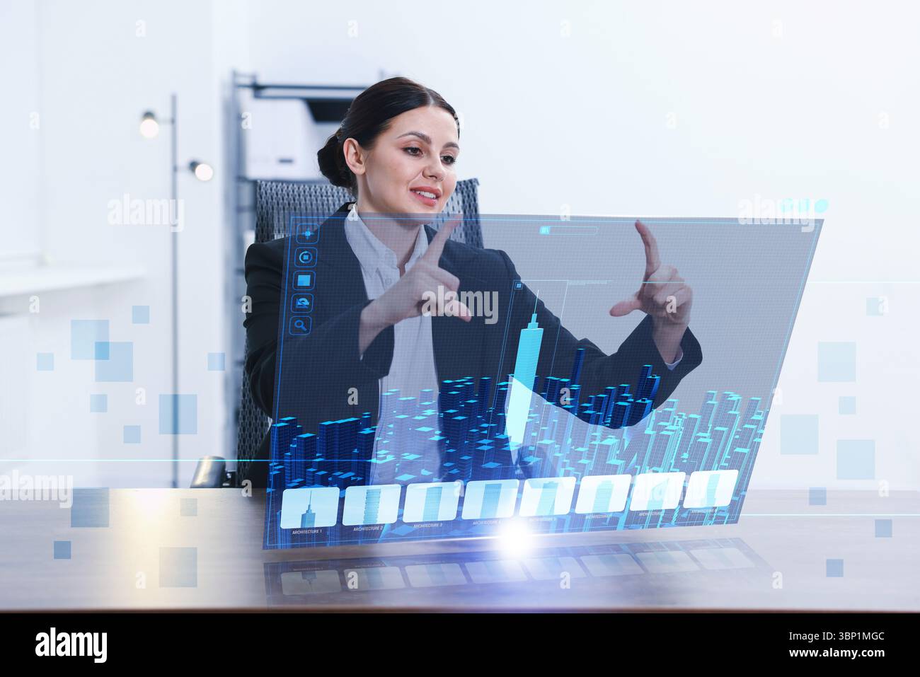 Building information modelling. Woman using virtual screen in office Stock Photo