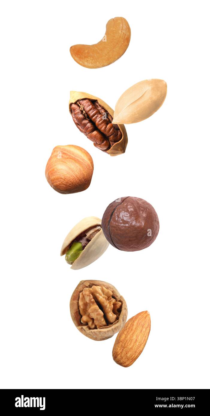 Peanut and other nuts falling on white background Stock Photo