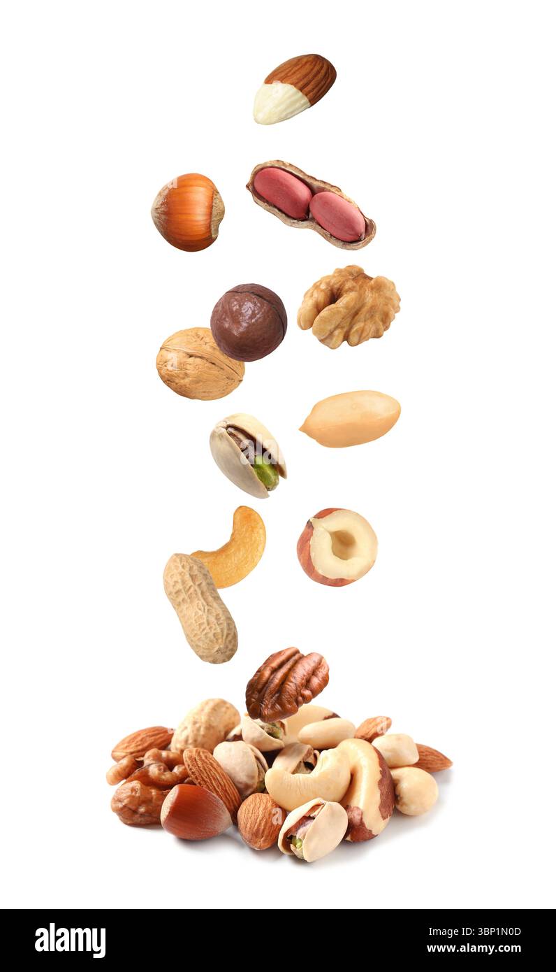 Peanut and other nuts falling on white background Stock Photo