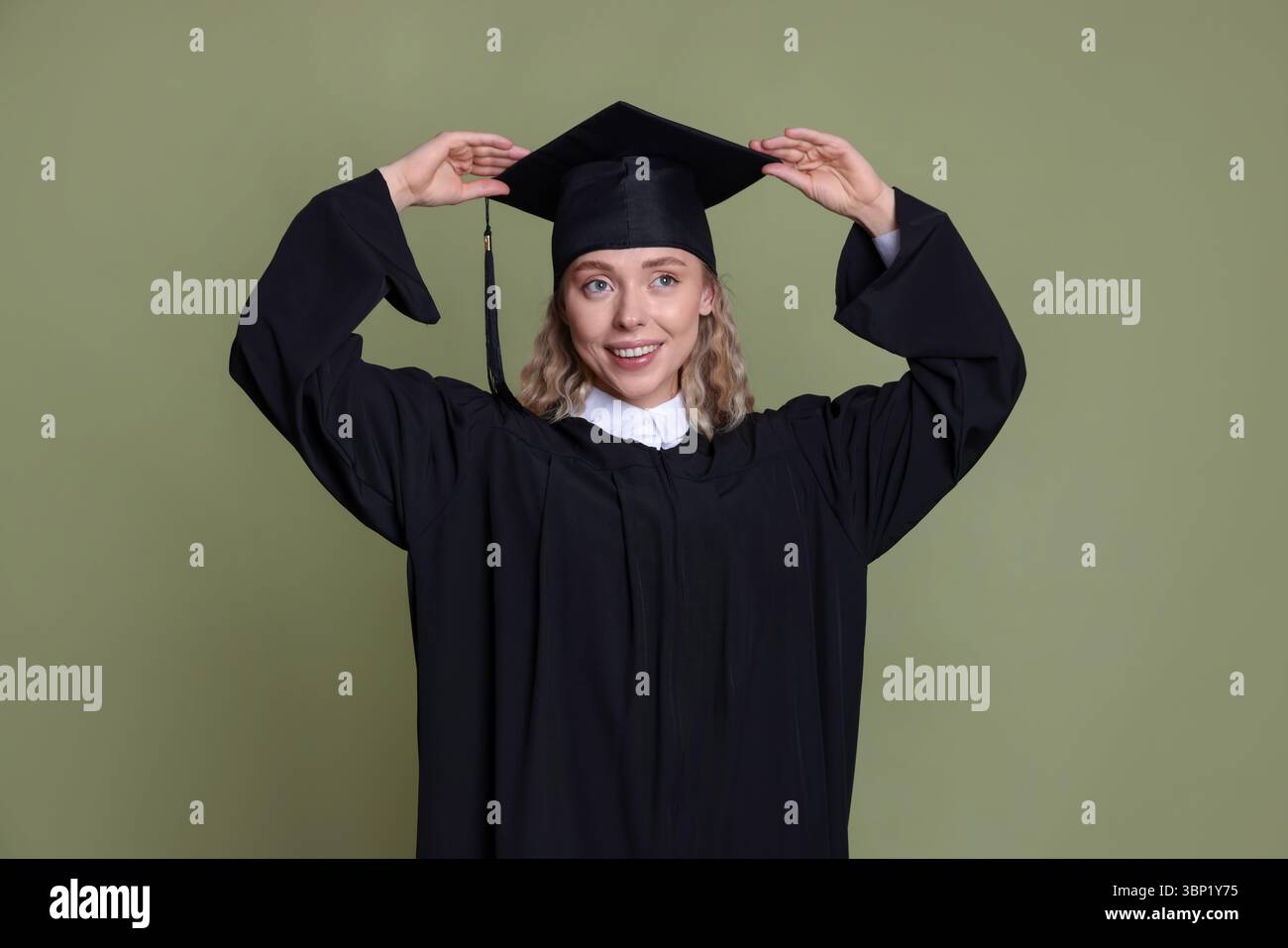 Happy student after graduation on green background Stock Photo - Alamy