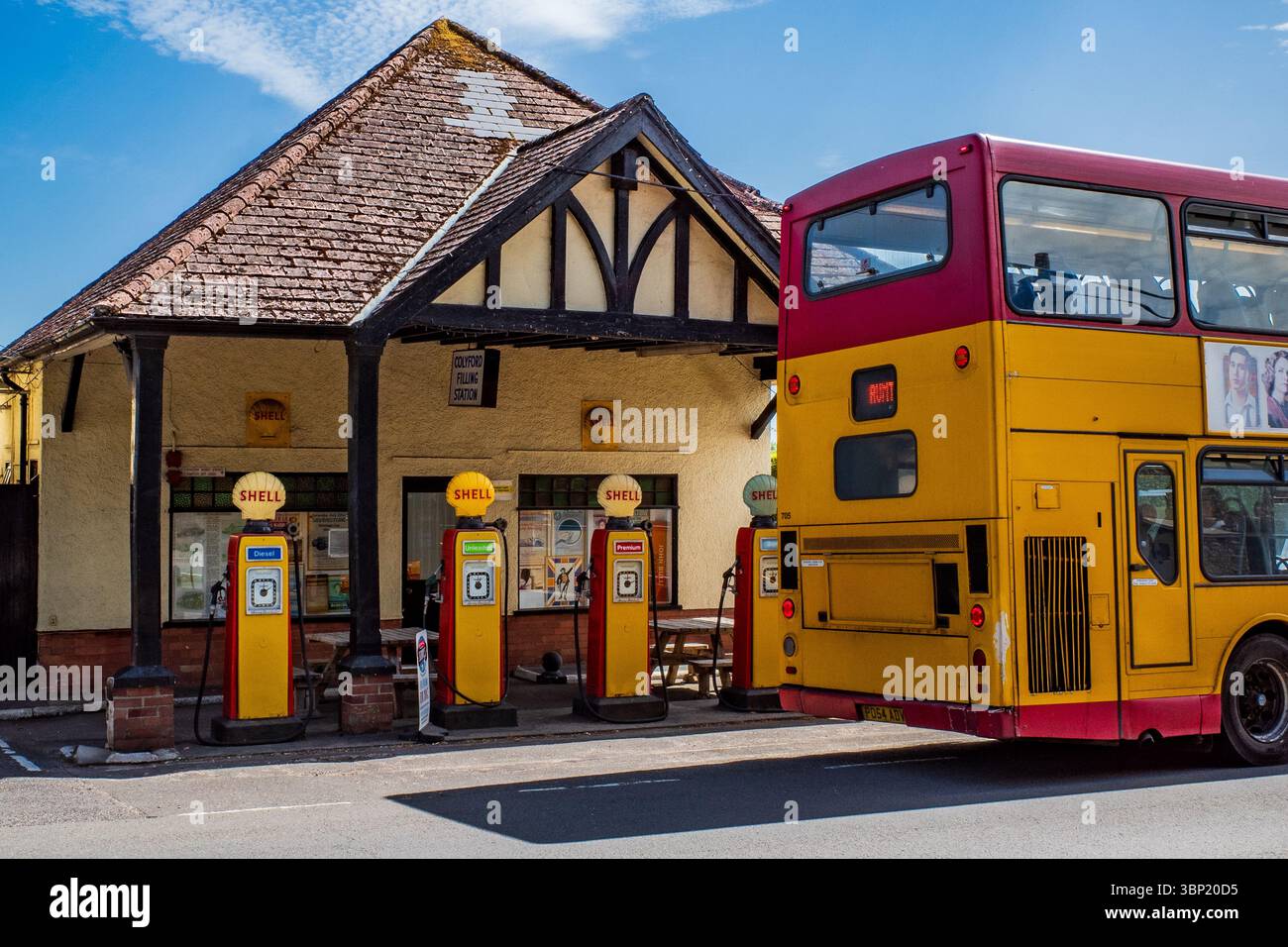 Restored old Shell filling station with original pumps built around ...