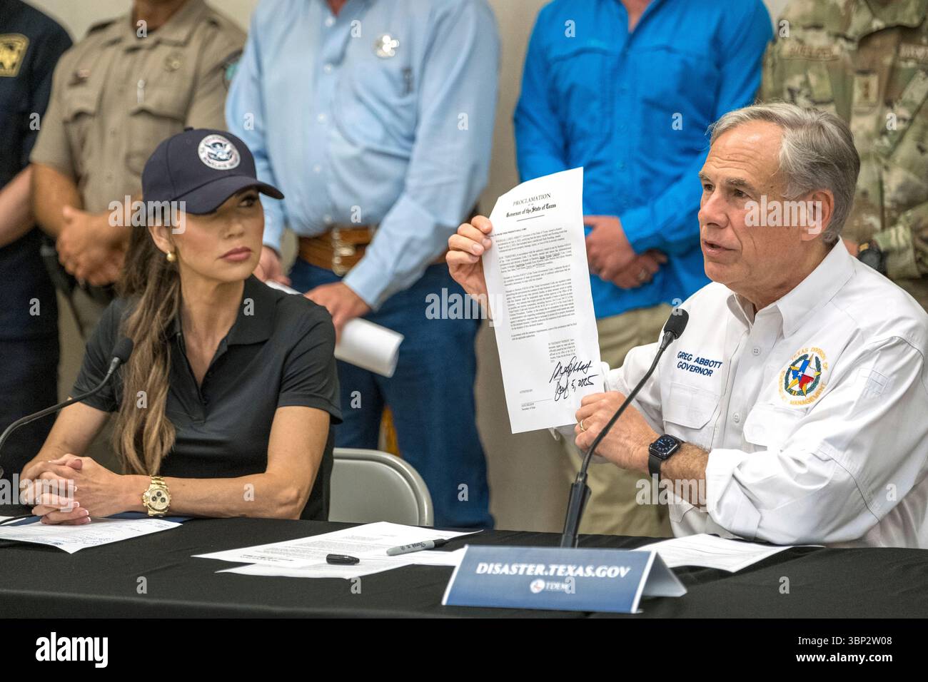 Texas Gov. Greg Abbott signs and holds up an disaster declaration ...