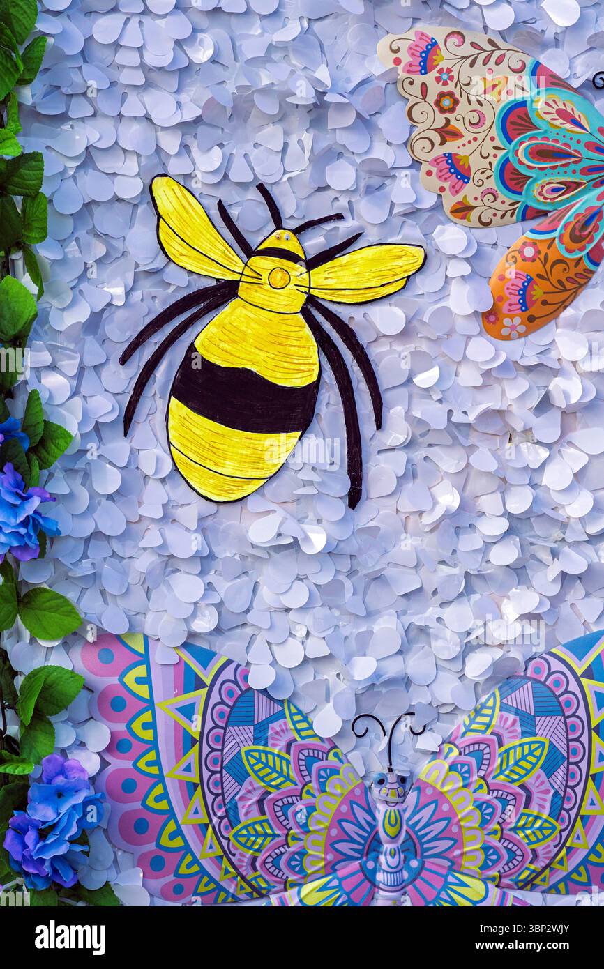 Bee and butterflies on a textured background Stock Photo