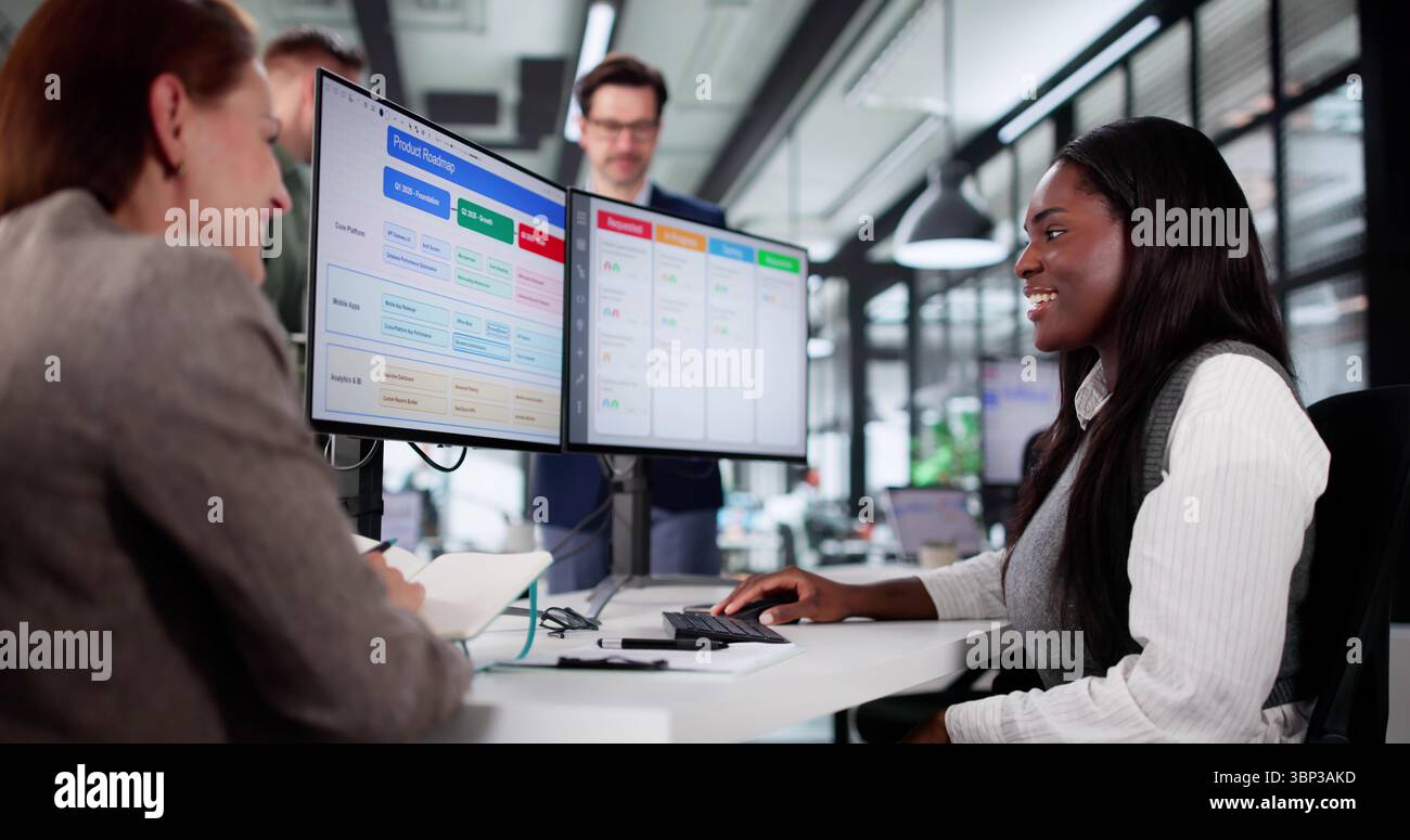 Busy Young Project Manager Organizes Team Schedule With Kanban Software. Stock Photo