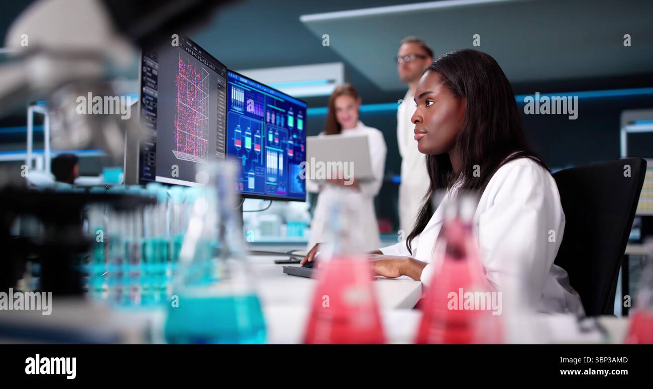 Scientist Conducts Research In Manufacturing Laboratory Using Technology Stock Photo