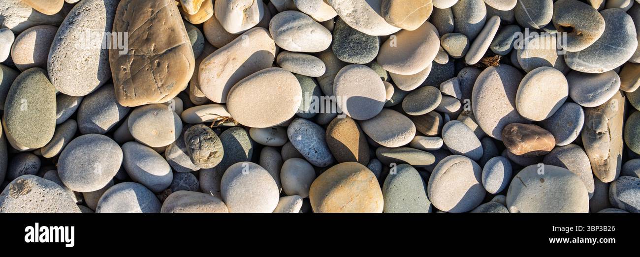 Smooth Beach Pebbles Background. A Textural Symphony of Nature s ...