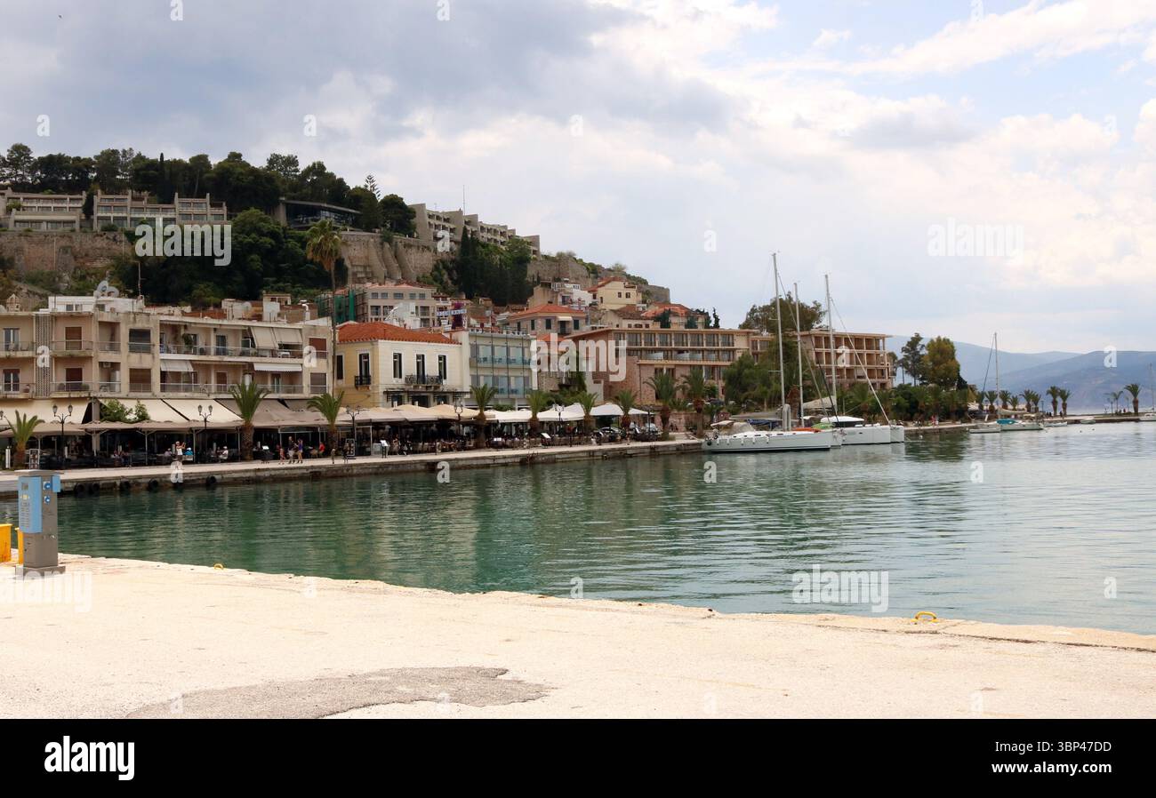 A photograph of the waterfront of Nafplio, Greece, featuring its city ...