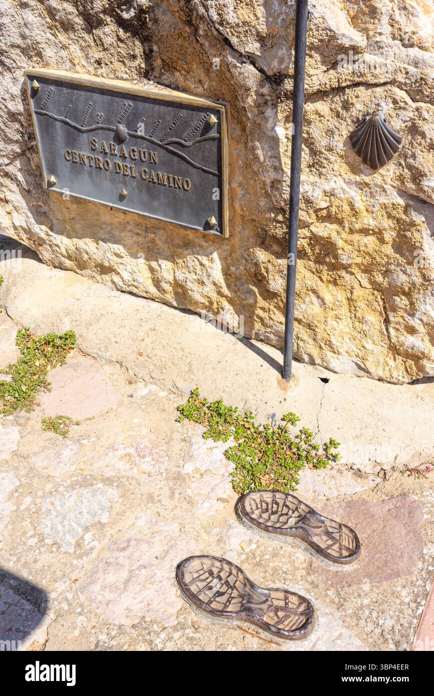 Milestone in Sahagun, Spain, marking the center of the Camino de Santiago, featuring boot prints embedded in the ground Stock Photo