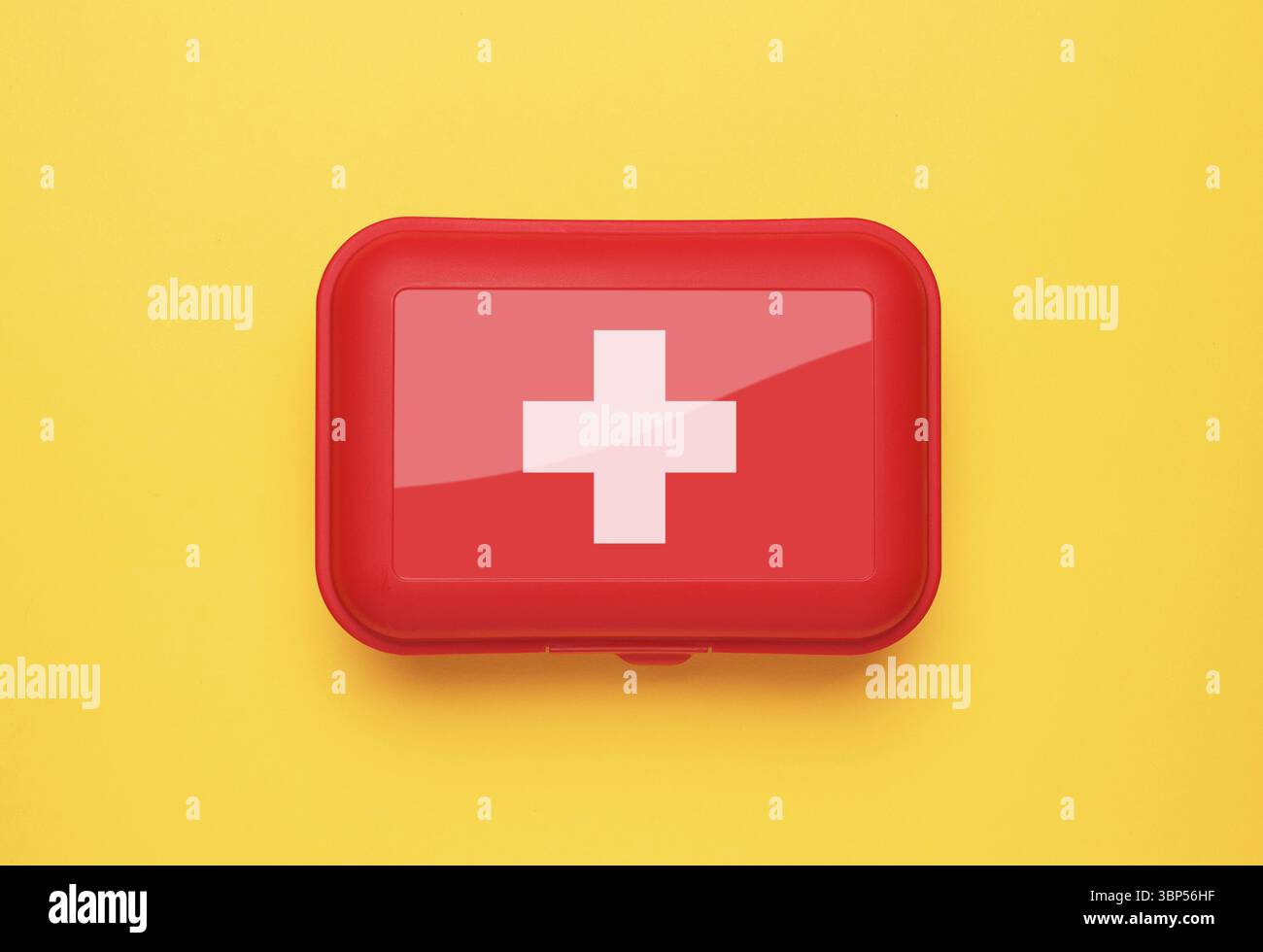 First Aid Kit on yellow background Stock Photo