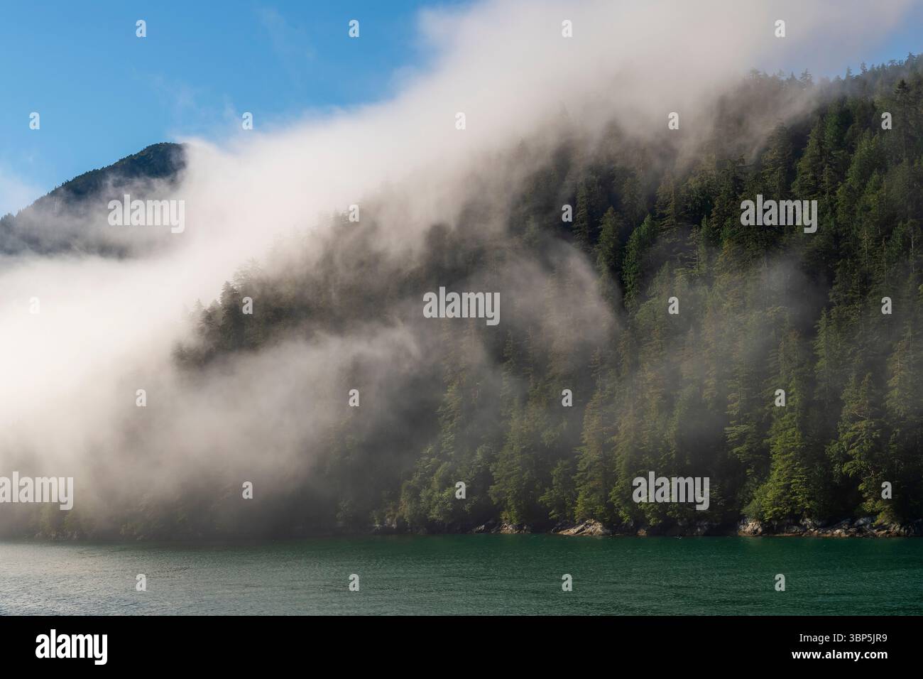 Inside passage cruise fog landscape between Prince Rupert and Port Hardy, Vancouver Island, British Columbia, Canada. Stock Photo