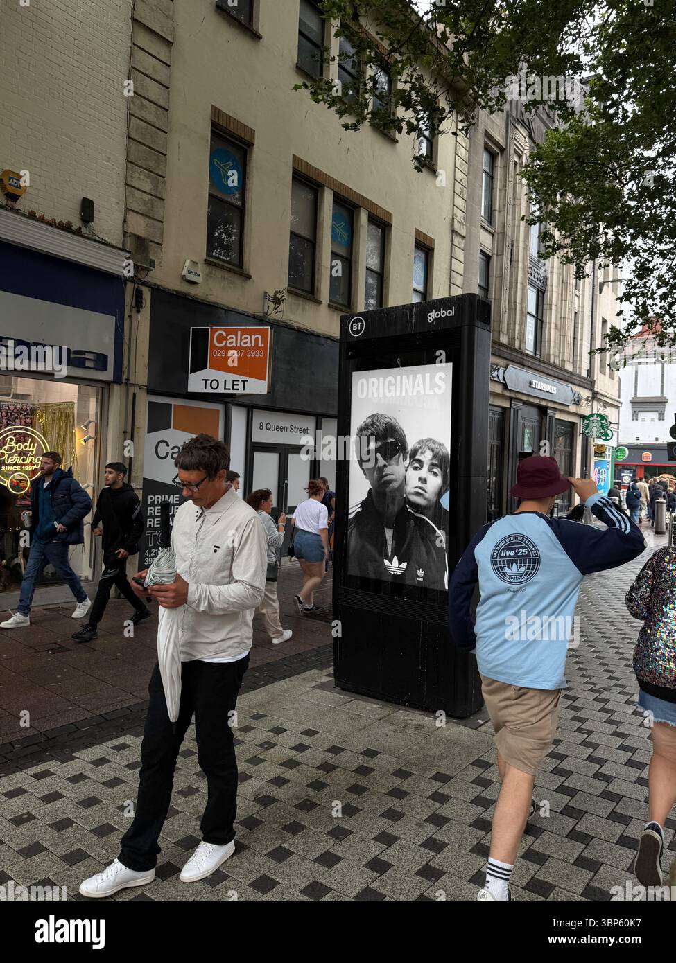 Adidas Digital Advertising Display Featuring Gallagher Brothers in Cardiff During Oasis Live ’25 Tour - Smartphone Captured Stock Image