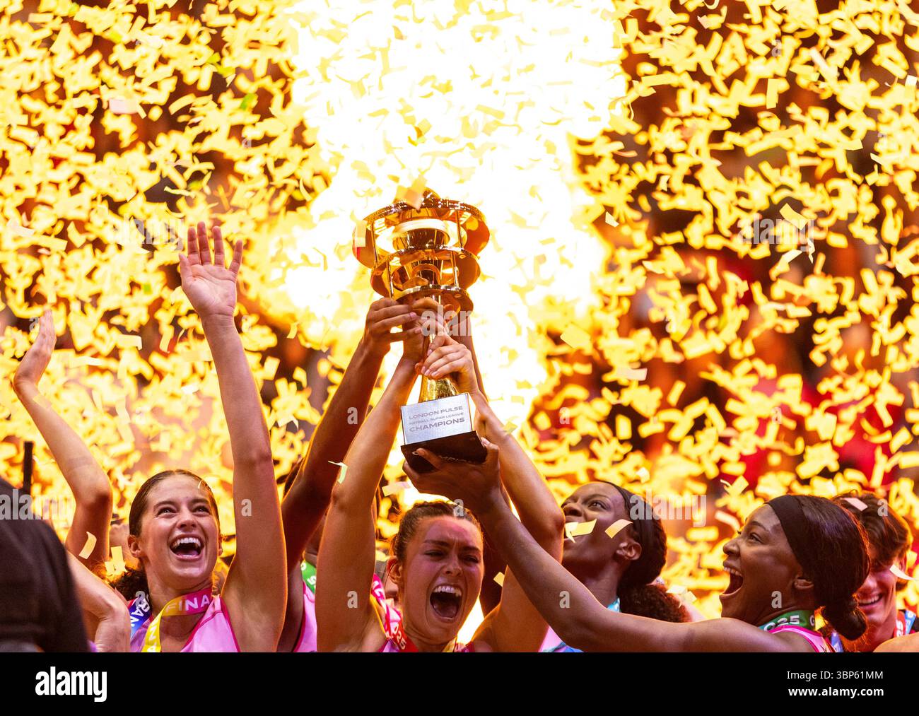 London Pulse players celebrate with the trophy after winning the ...
