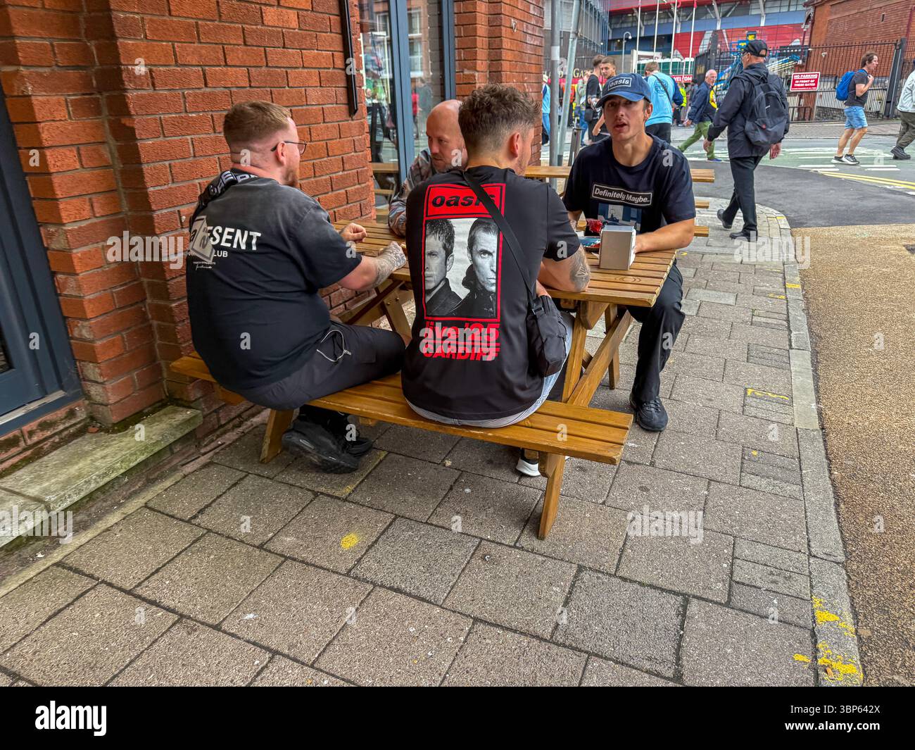 Oasis Fans and Buskers in Cardiff City Centre During Oasis Live ’25 Reunion Tour - Smartphone Captured Stock Image
