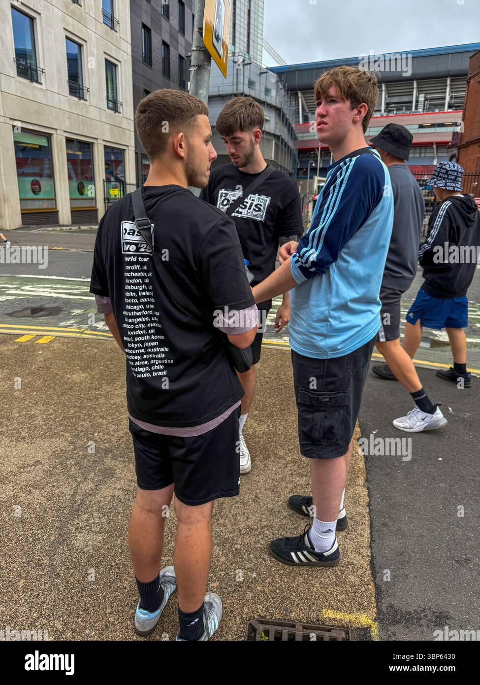 Oasis Fans and Buskers in Cardiff City Centre During Oasis Live ’25 Reunion Tour - Smartphone Captured Stock Image