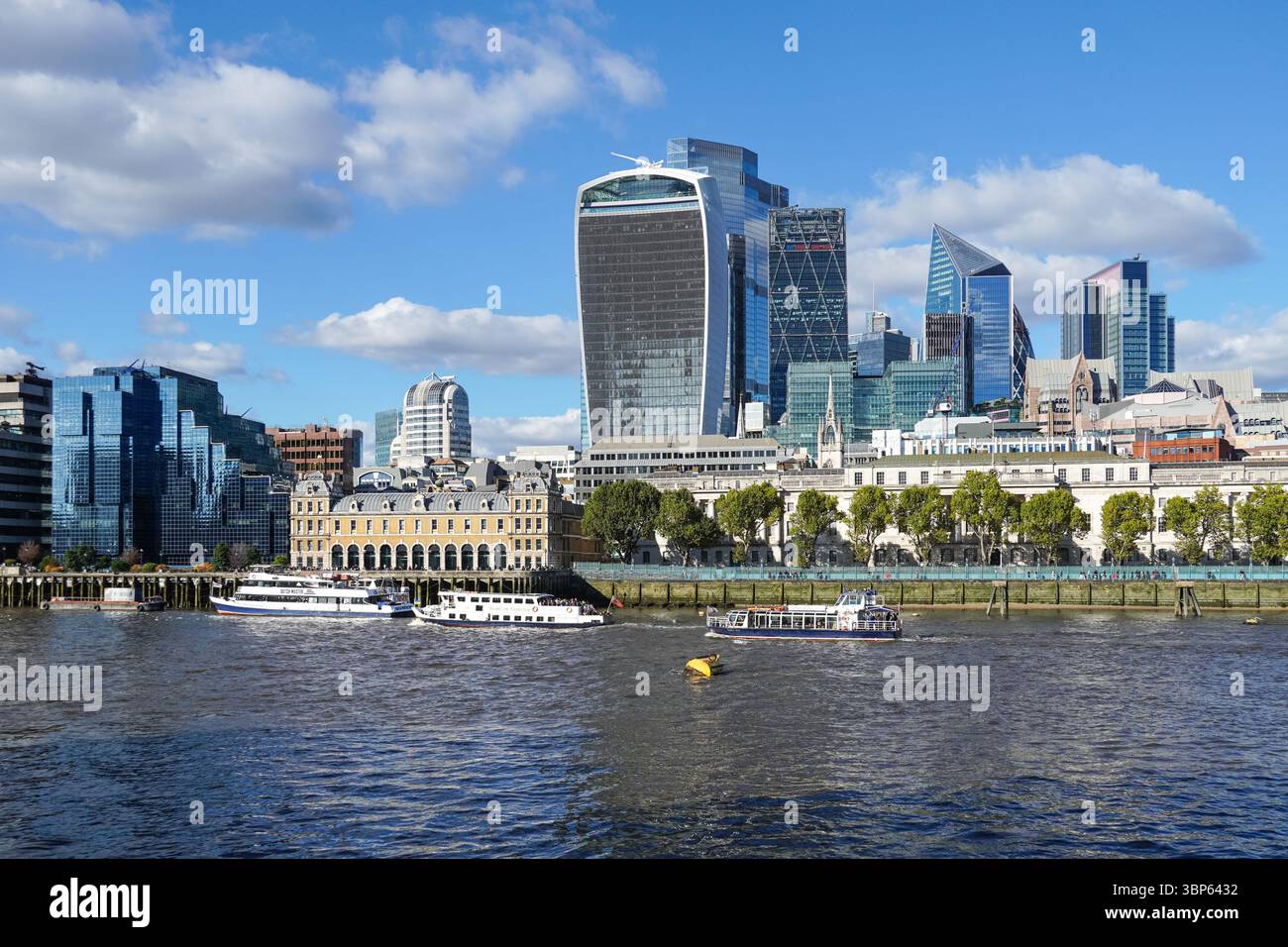 The City of London skyscrapers seen from the river Thames, The Square Mile business district in London, England, United Kingdom UK Stock Photo