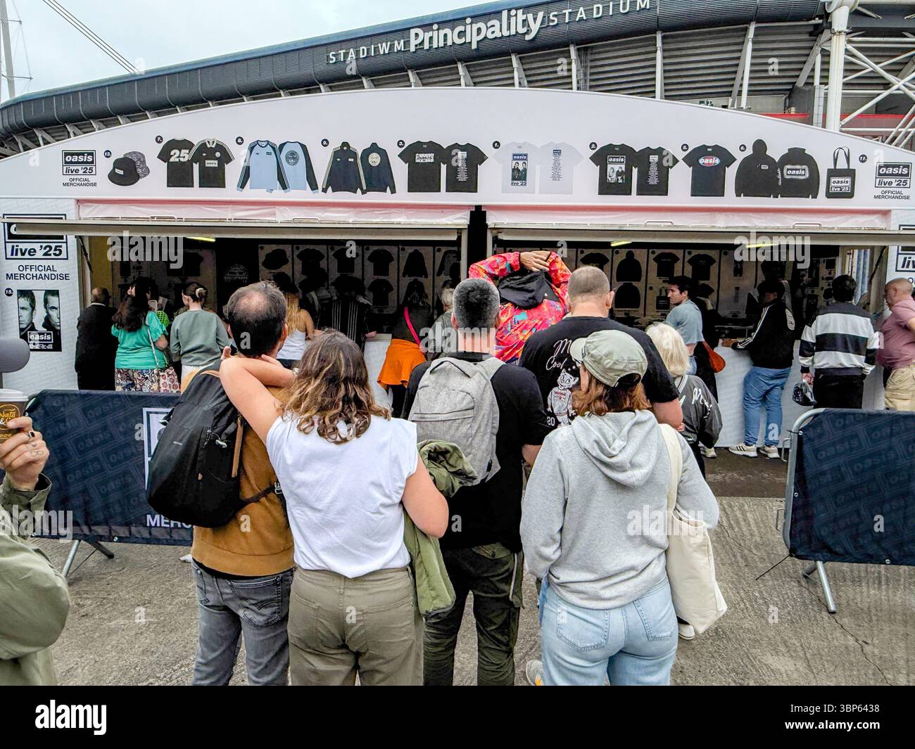 Oasis Fans and Buskers in Cardiff City Centre During Oasis Live ’25 Reunion Tour - Smartphone Captured Stock Image