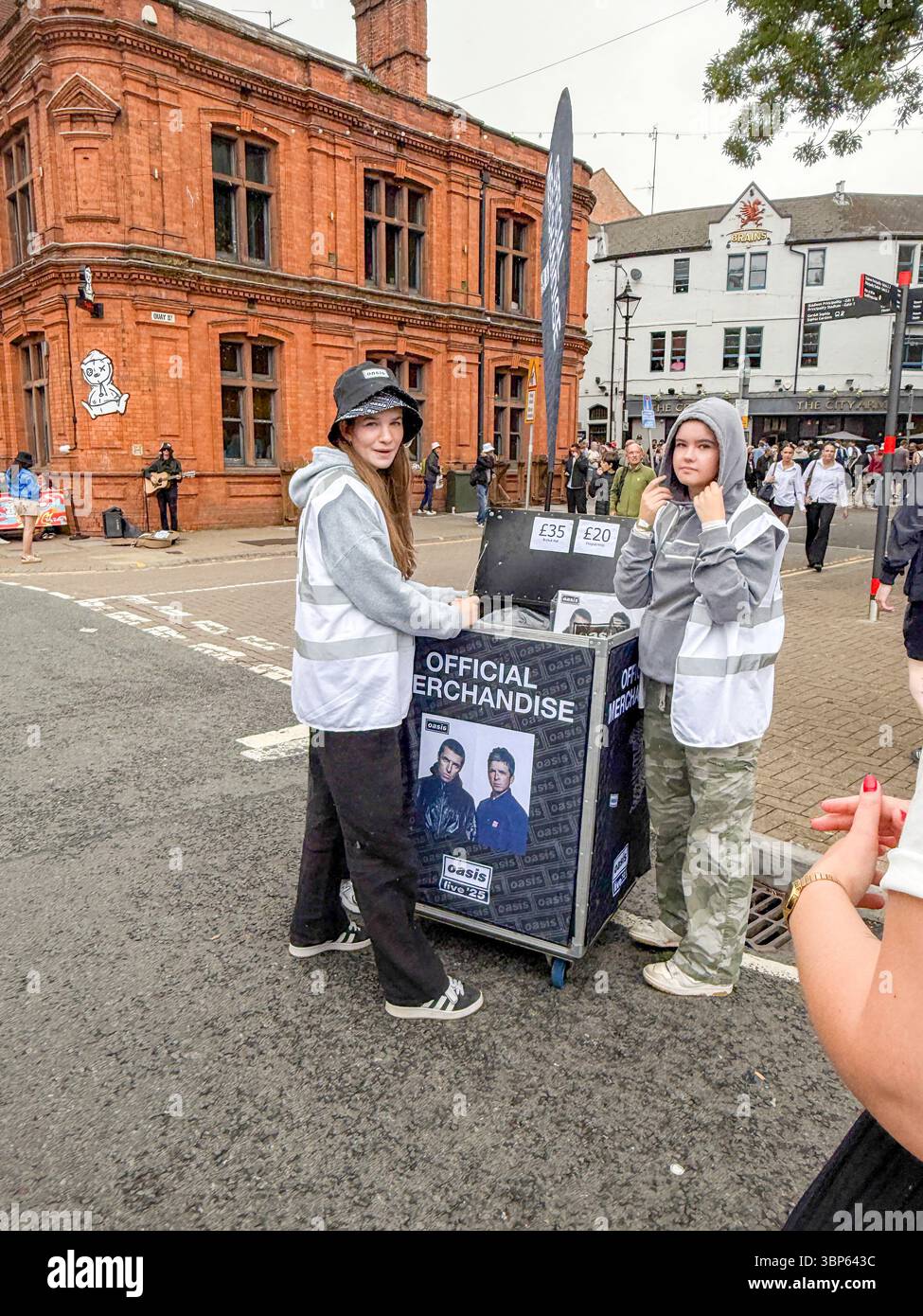 Oasis Fans and Buskers in Cardiff City Centre During Oasis Live ’25 Reunion Tour - Smartphone Captured Stock Image