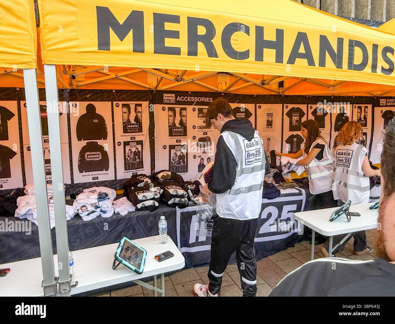 Oasis Fans and Buskers in Cardiff City Centre During Oasis Live ’25 Reunion Tour - Smartphone Captured Stock Image