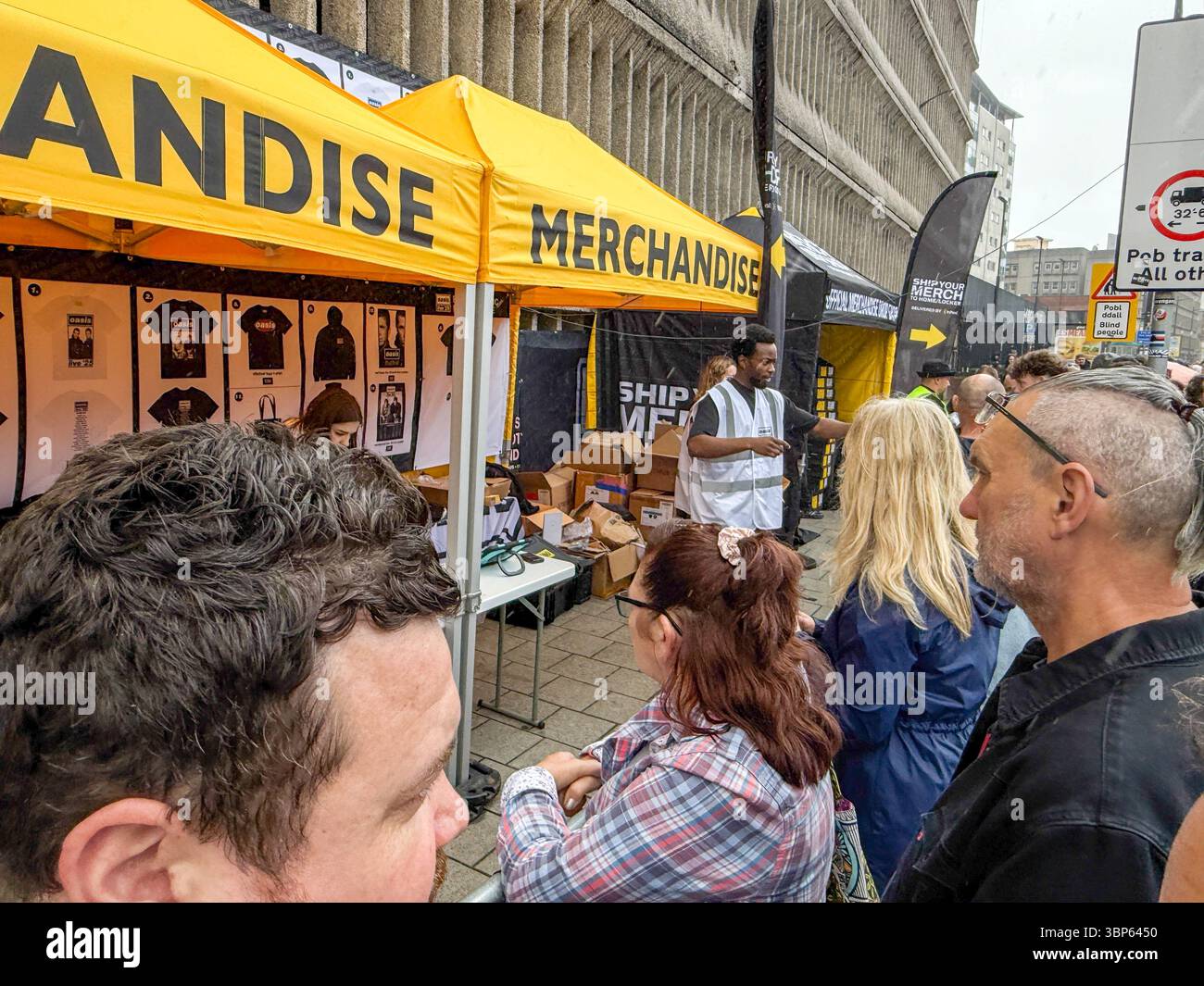 Oasis Fans and Buskers in Cardiff City Centre During Oasis Live ’25 Reunion Tour - Smartphone Captured Stock Image
