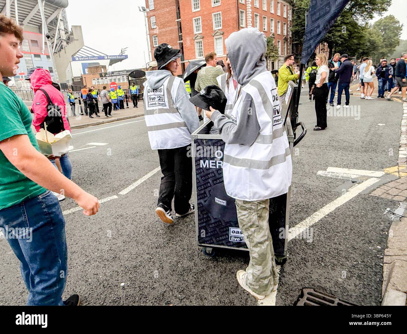 Oasis Fans and Buskers in Cardiff City Centre During Oasis Live ’25 Reunion Tour - Smartphone Captured Stock Image