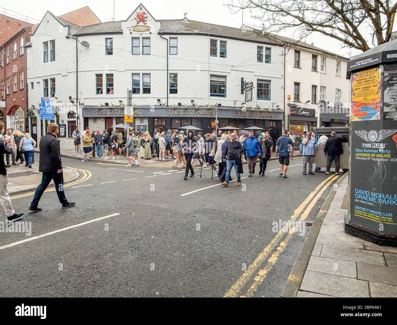 Oasis Fans and Buskers in Cardiff City Centre During Oasis Live ’25 Reunion Tour - Smartphone Captured Stock Image