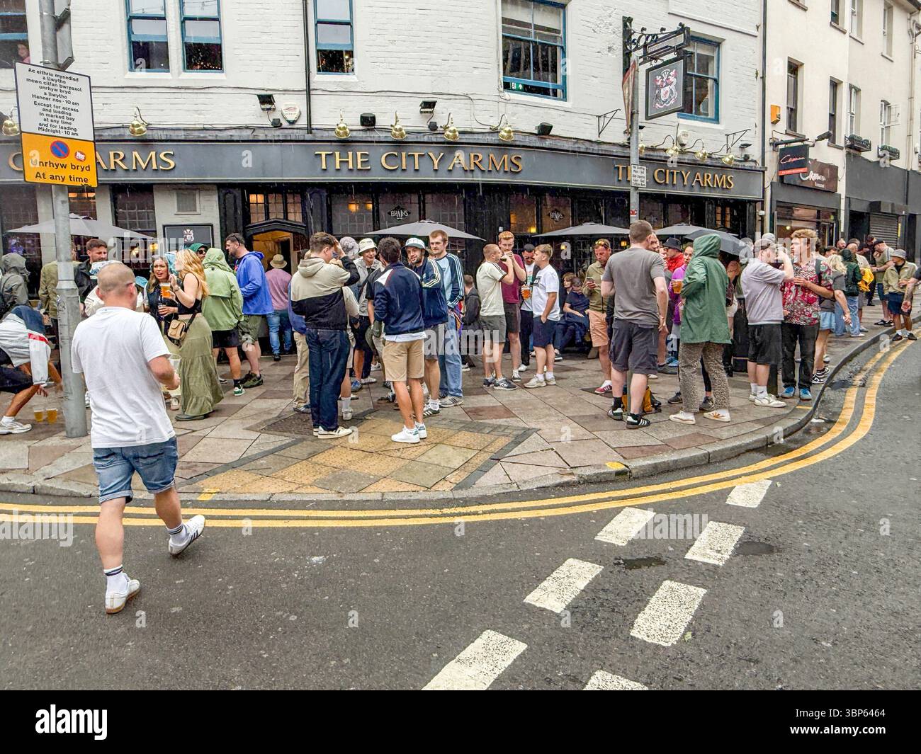 Oasis Fans and Buskers in Cardiff City Centre During Oasis Live ’25 Reunion Tour - Smartphone Captured Stock Image