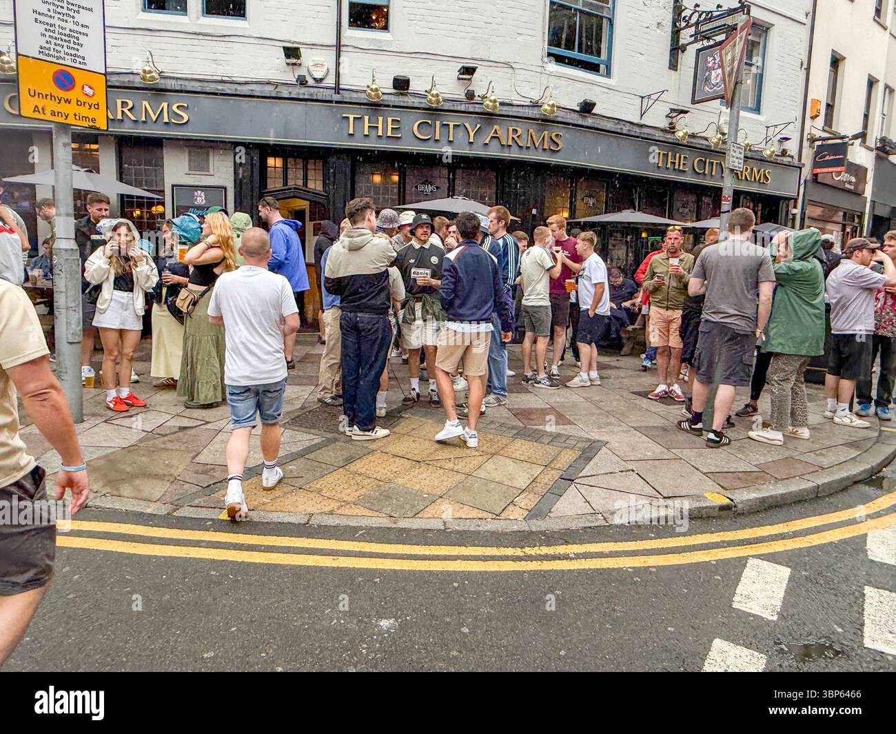 Oasis Fans and Buskers in Cardiff City Centre During Oasis Live ’25 Reunion Tour - Smartphone Captured Stock Image