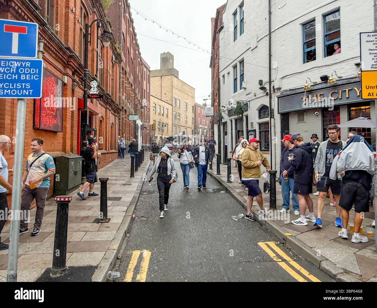 Oasis Fans and Buskers in Cardiff City Centre During Oasis Live ’25 Reunion Tour - Smartphone Captured Stock Image