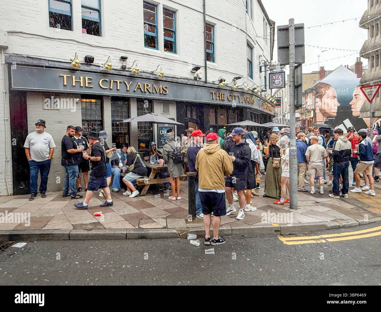 Oasis Fans and Buskers in Cardiff City Centre During Oasis Live ’25 Reunion Tour - Smartphone Captured Stock Image