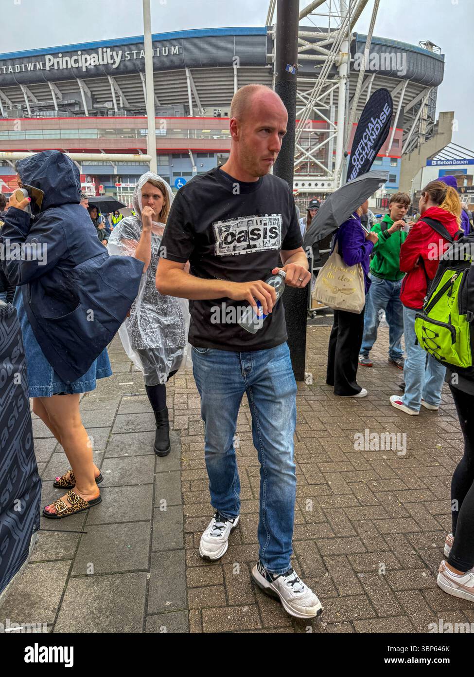 Oasis Fans and Buskers in Cardiff City Centre During Oasis Live ’25 Reunion Tour - Smartphone Captured Stock Image