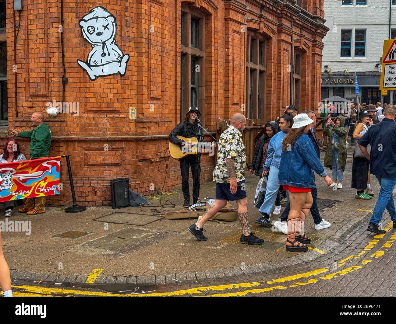 Oasis Fans and Buskers in Cardiff City Centre During Oasis Live ’25 Reunion Tour - Smartphone Captured Stock Image