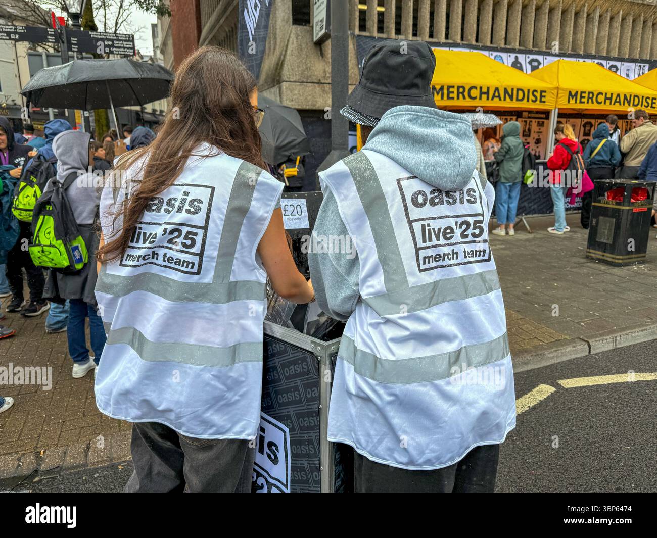 Oasis Fans and Buskers in Cardiff City Centre During Oasis Live ’25 Reunion Tour - Smartphone Captured Stock Image