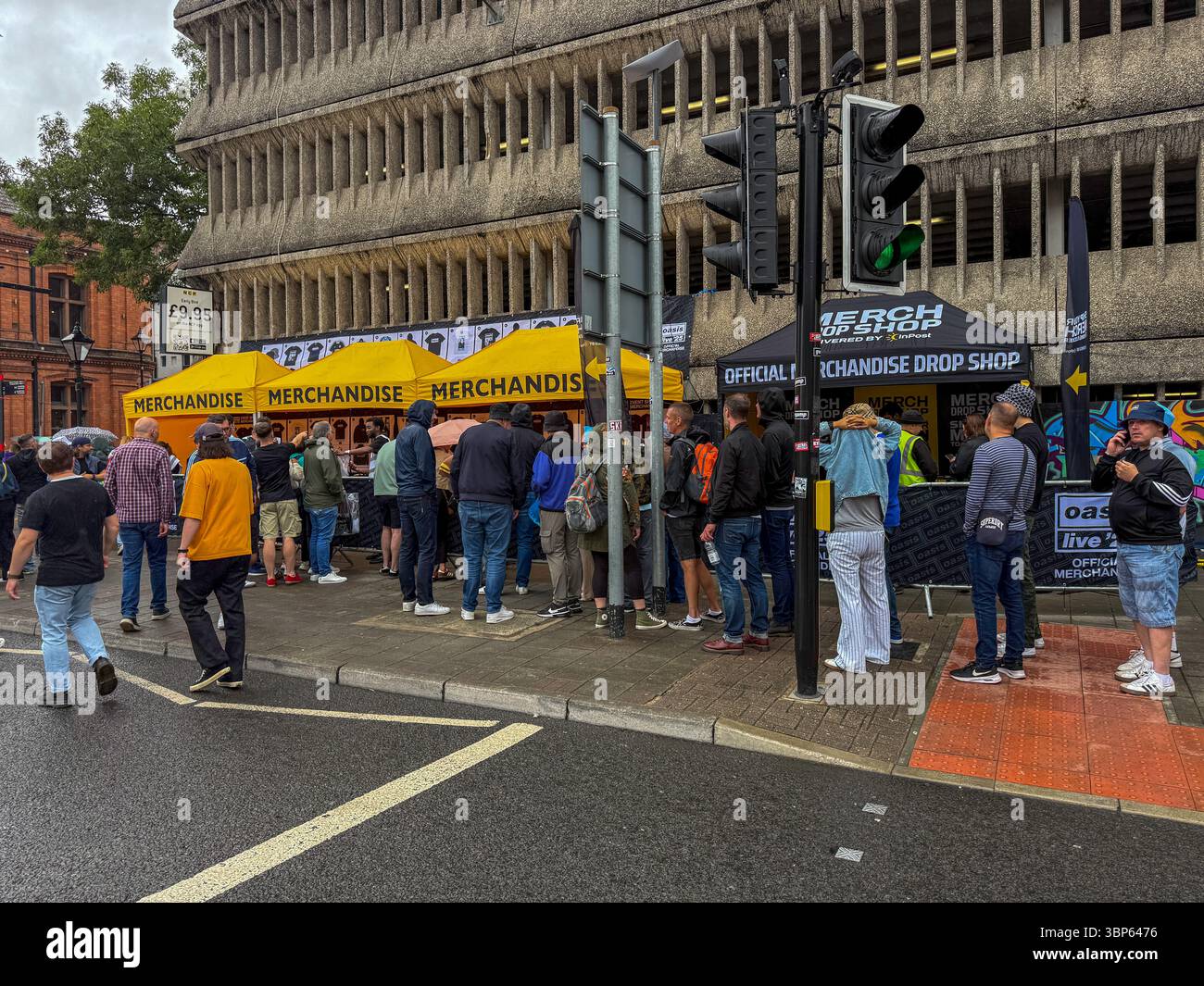 Oasis Fans and Buskers in Cardiff City Centre During Oasis Live ’25 Reunion Tour - Smartphone Captured Stock Image