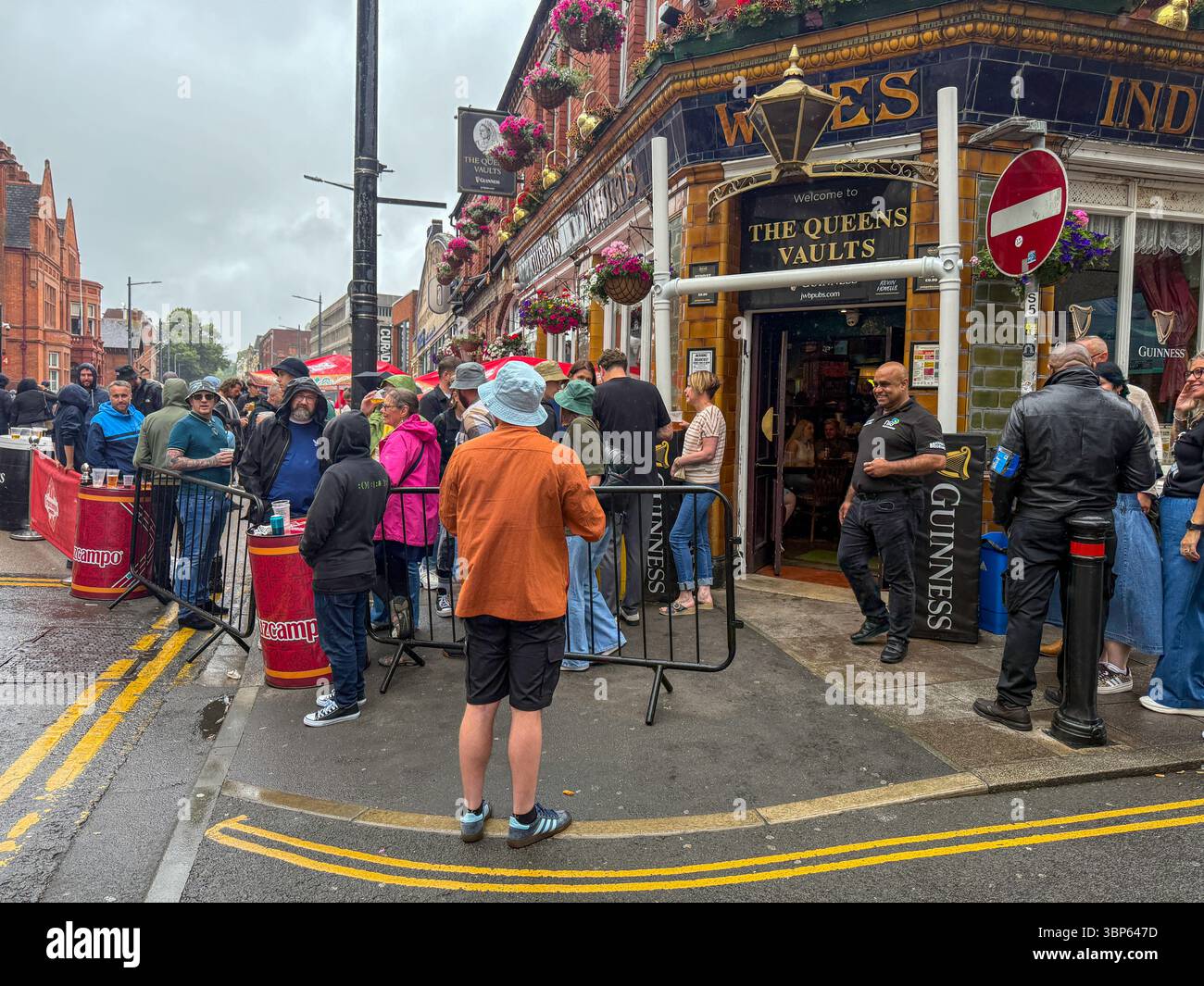Oasis Fans and Buskers in Cardiff City Centre During Oasis Live ’25 Reunion Tour - Smartphone Captured Stock Image