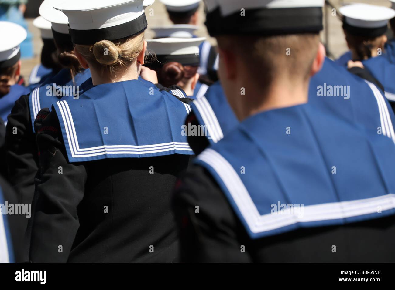 Navy sailors in uniform with their backs to camera Uniformed Heads and ...