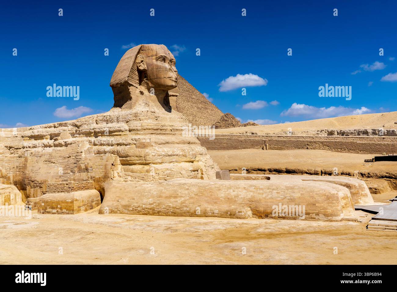 View of the Sphinx, behind which is the pyramid of Cheops Stock Photo ...
