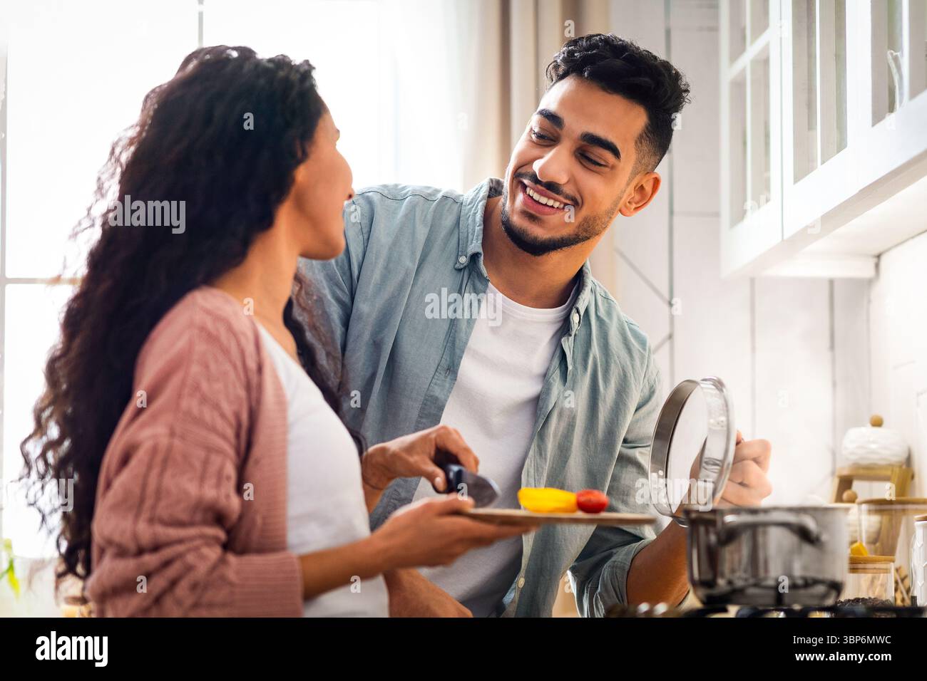 Happy Middle Eastern Spouses Preparing Lunch Together In Kitchen Stock Photo