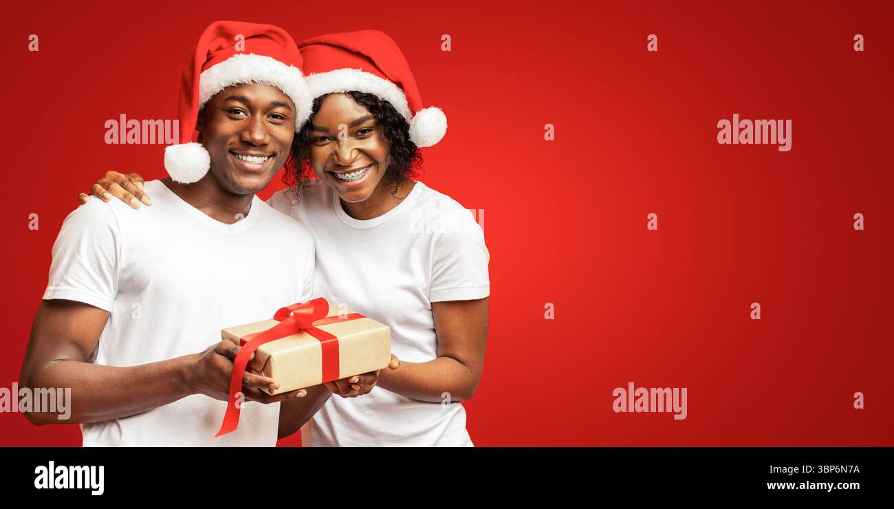 Happy black man and woman celebrating Christmas together Stock Photo