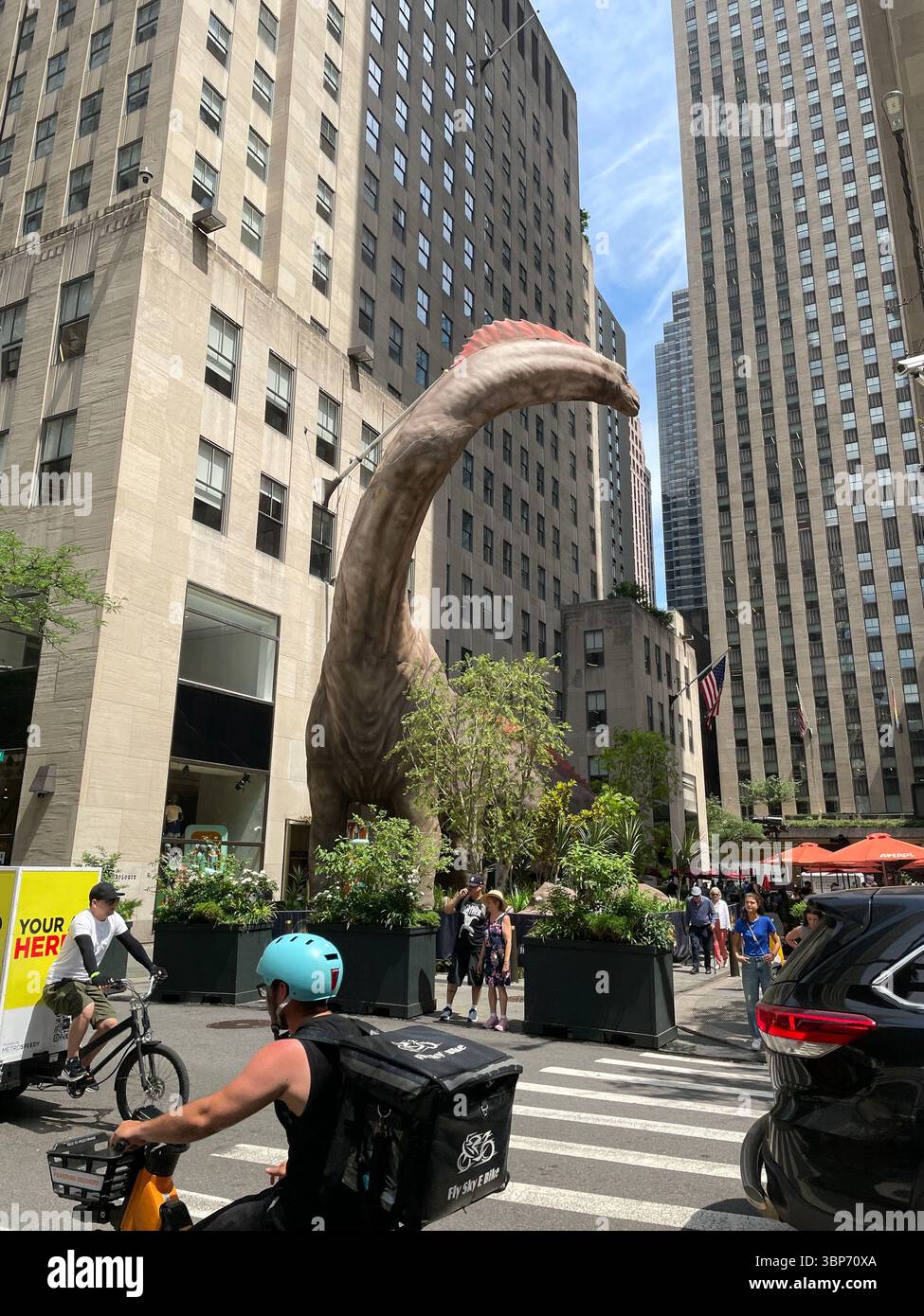 A 'Jurassic World Rebirth' promotion in Rockefeller Center features a five story tall dinosaur, 2025, New York City, USA - Smartphone Captured Stock Image