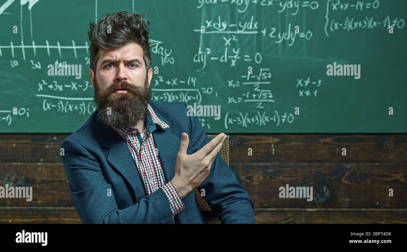 Professor Ideas Math Teacher explains math in class. Professor in classroom on math lesson ...
