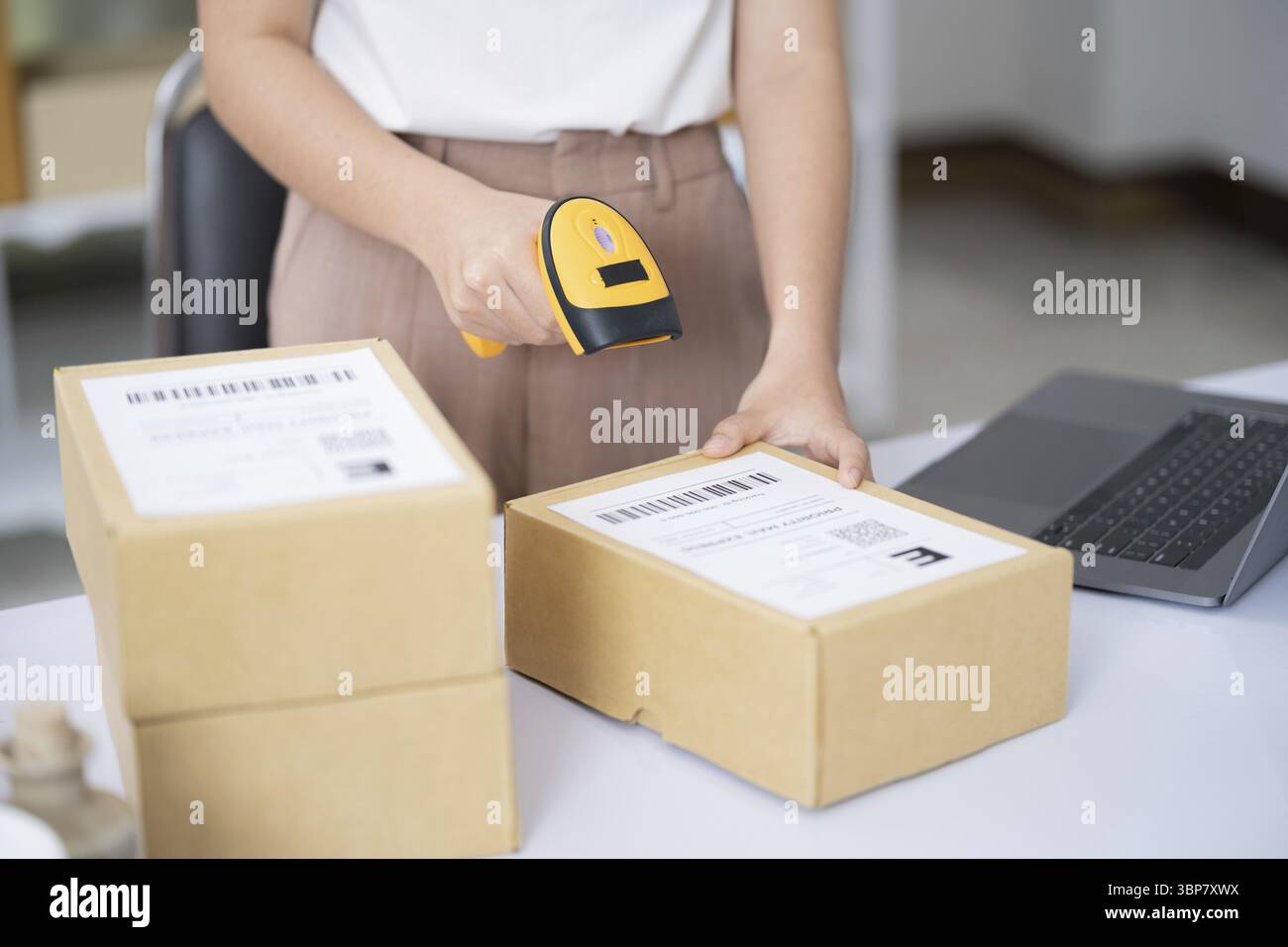 Hands scanning barcode on hi-res stock photography and images - Alamy