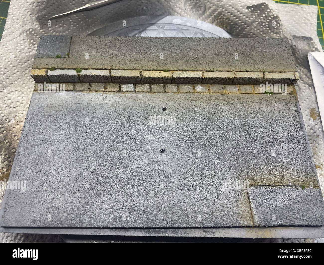 Realistically weathered model road section with pavement Stock Photo ...