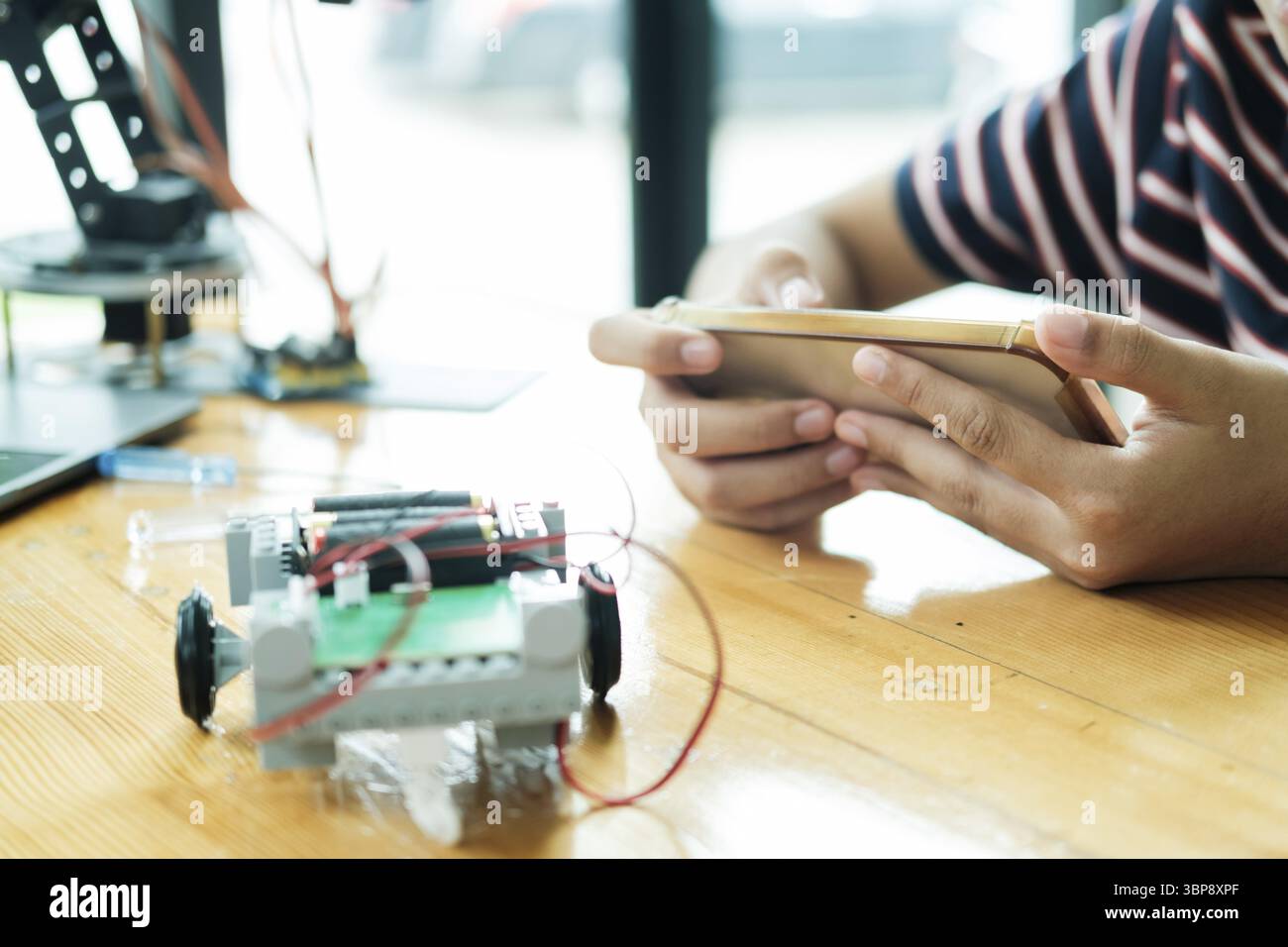 Student learning STEM education robotics for creating project studying for innovation robot models. New study generation for DIY electronic kits in ma Stock Photo