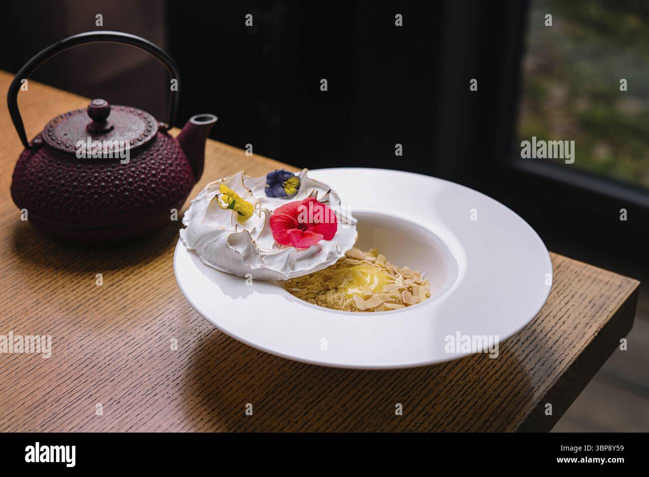 Food, Meringue on plate and almonds with vanilla custard Stock Photo