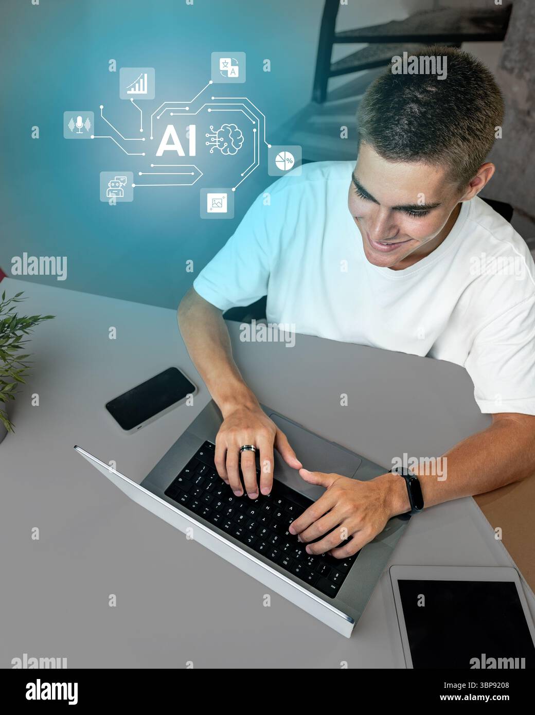 Young man engaged in creative work using a laptop and exploring artificial intelligence concepts at home Stock Photo