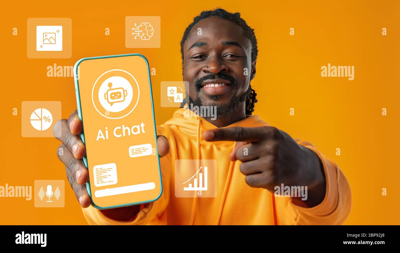 Smiling man showcasing an AI chat application on a smartphone against a vibrant orange background Stock Photo