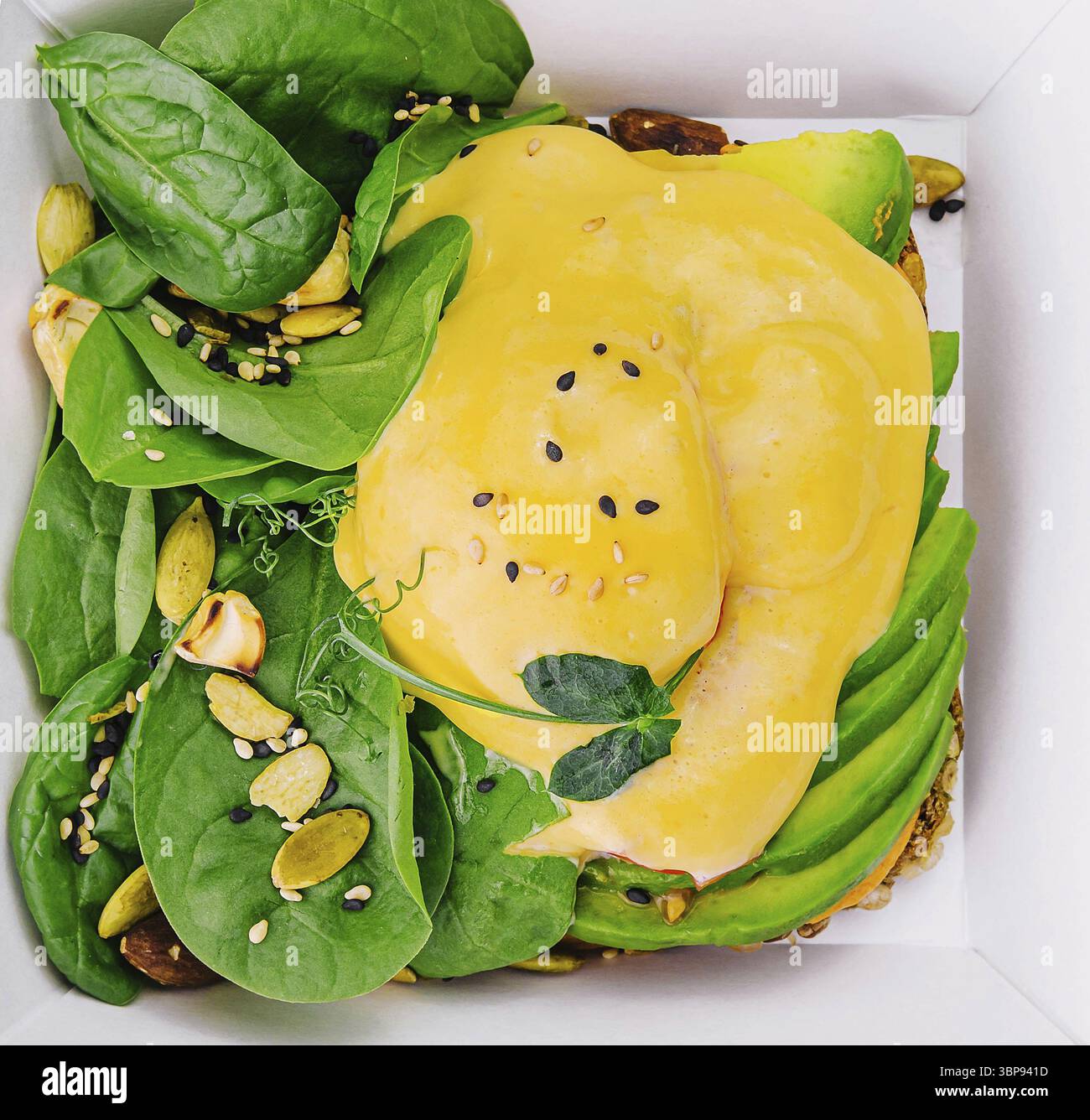 Food, Avocado sandwich and poached eggs on rye bread Stock Photo