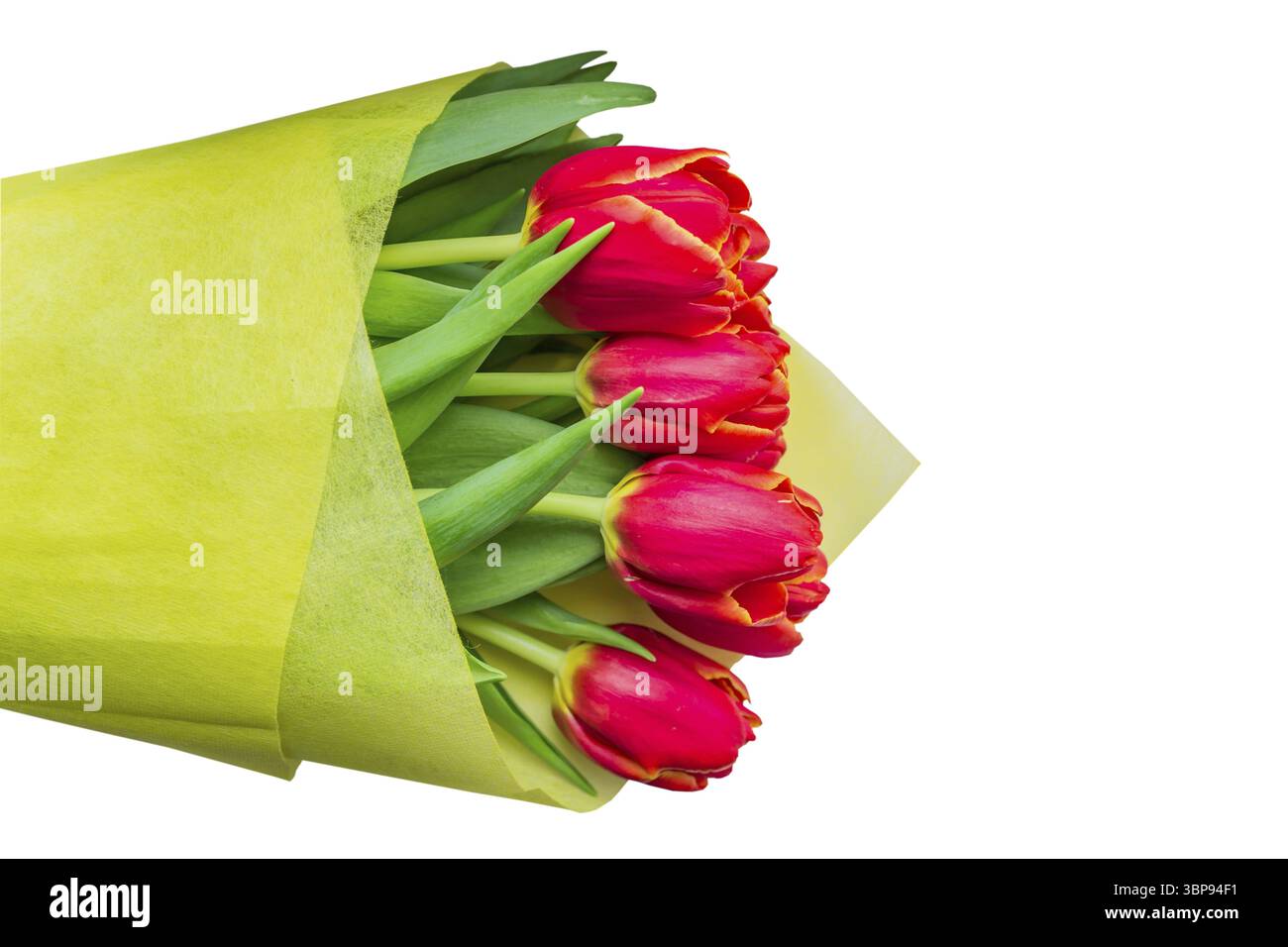 Bouquet of red tulips in yellow wrapping paper isolated on white background Stock Photo
