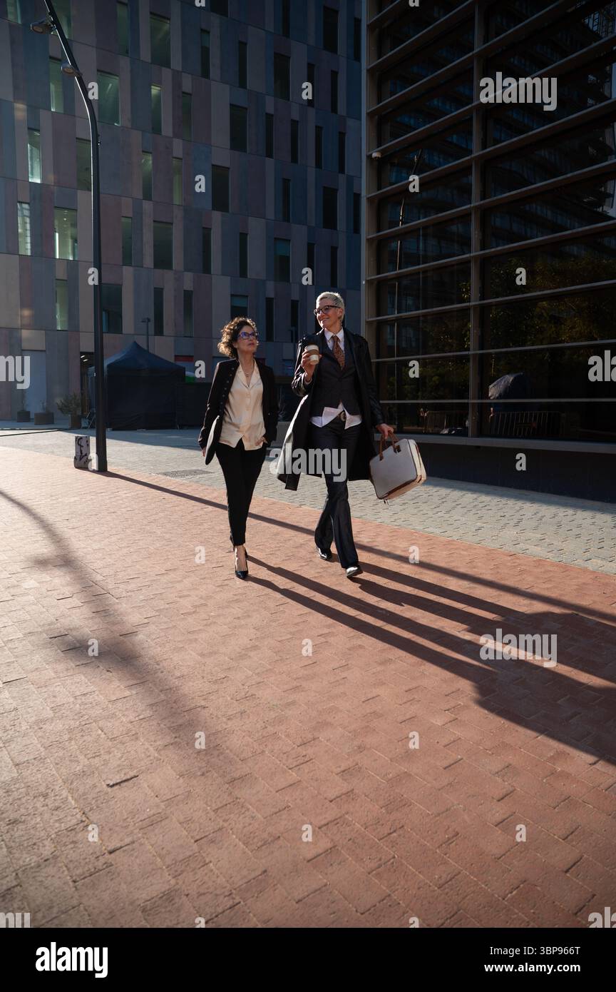 Professional women walking in barcelona business district Stock Photo