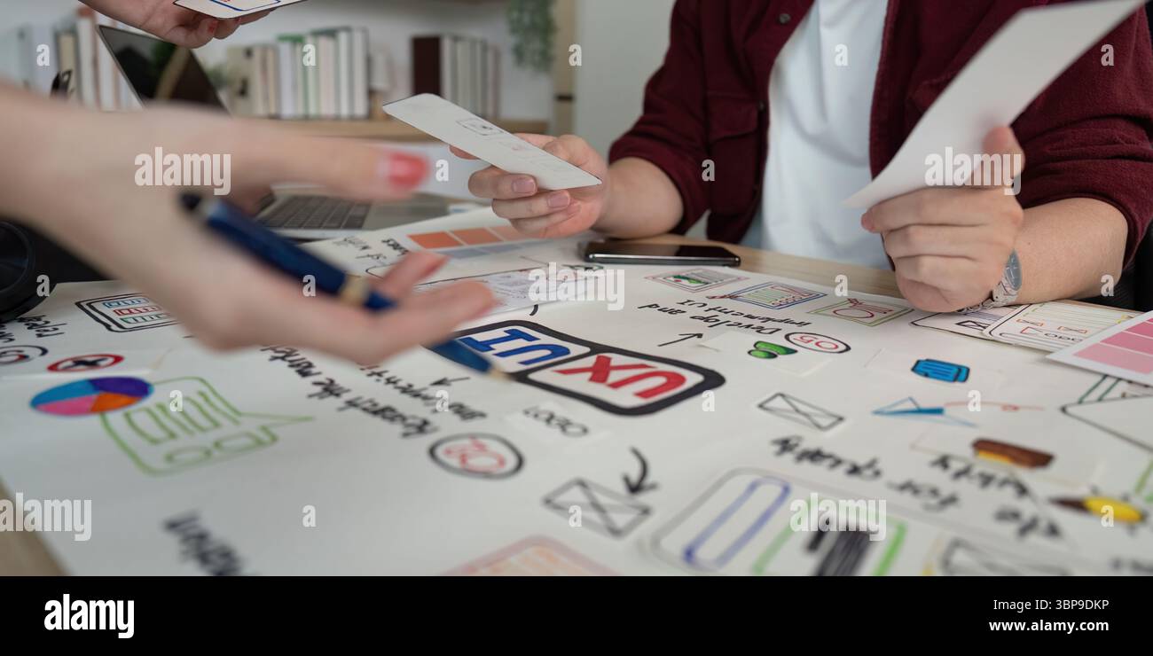 UX and UI design team reviewing project ideas. Stock Photo